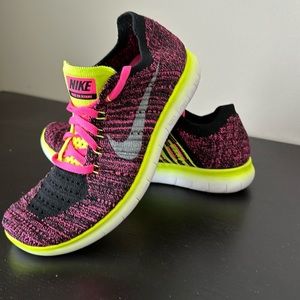 Nike Free Flyknit Kid’s size 4.5Y. This is a lightly worn pair of running shoes.